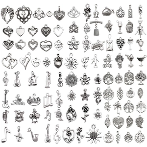 Mixed set of silver alloy charms including hearts, flowers, music and tree of life motifs