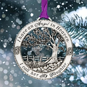 Memorial tree ornament with 'I have an Angel in Heaven' text on winter background