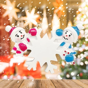 Close-up of personalized resin snowman Christmas ornament with a blank white snowflake