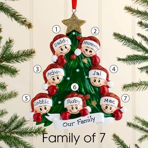 Detail of Christmas tree ornament for 7 family members with red hats and gold star