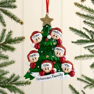Detailed close-up of a resin Christmas tree ornament with six family members and stars