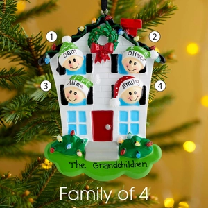 Resin Christmas ornament featuring a family of 4 house design on pine branches