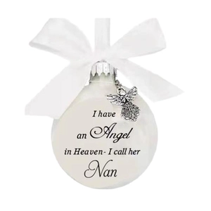 Memorial Christmas ball with angel wing charm and ribbon for Nan on white background
