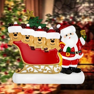 Close-up of reindeer family Christmas ornament with Santa, sleigh, and glittery tree