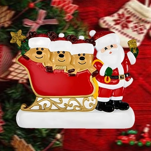 Detail of resin Santa Claus and reindeers in a red sleigh Christmas decoration