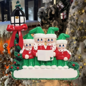 Close-up of a snowman family Christmas ornament with street lamp and customizable banner