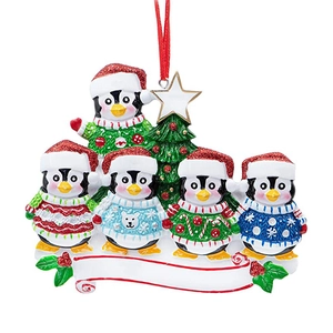 Personalized Christmas tree ornament featuring five penguins in festive sweaters