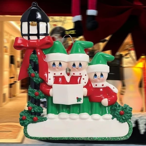 Three Christmas elves hanging ornament around a black street lamp with customizable banner
