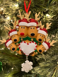 Close-up of resin reindeer family ornament with customizable heart and snowflake detail