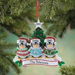 Customized penguin family resin ornament on Christmas tree with names and 2022 star