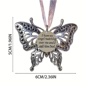 Detail view of butterfly memorial ornament with engraved Father tribute and pink ribbon