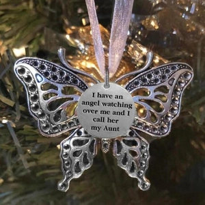 Angel wing butterfly ornament with aunt memorial inscription on a Christmas tree