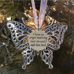 Silver alloy butterfly memorial ornament with heart charm and pink ribbon on Christmas tree