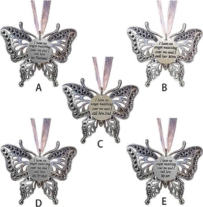 Detailed view of butterfly memorial ornaments with rhinestones and heartfelt inscriptions