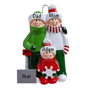 Close-up of resin family of three on sled Christmas ornament with hand-painted details