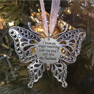 Angel wing butterfly memorial ornament with silver engraved heart on a purple ribbon