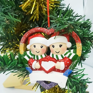 Detail of Christmas snowman heart ornament with DIY personalization space on tree