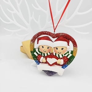 Customizable heart Christmas ornament featuring two cute snowmen with festive red glitter