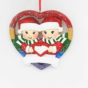 Detail of heart Christmas ornament with snowman couple and customizable white space