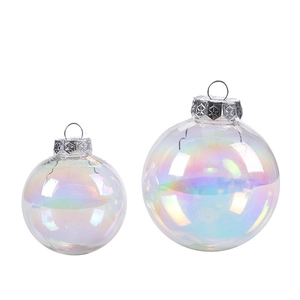 Iridescent transparent Christmas ornaments with decorative silver metal caps on white background