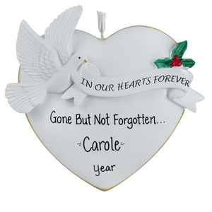 Detail of white resin heart ornament with a peace dove, holly berries, and personalized text