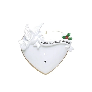 Close-up of heart-shaped resin ornament with dove detail and In Our Hearts Forever text