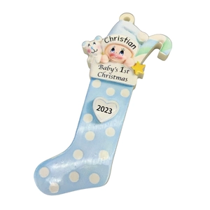 Detail of blue polka dot baby's first Christmas ornament with name Christian and year 2023