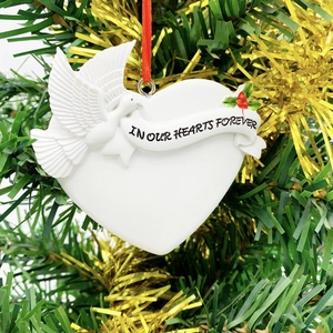 White heart resin Christmas ornament with dove and In Our Hearts Forever text