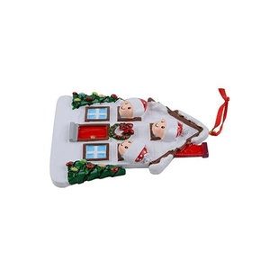 Christmas house resin hanging ornament featuring a family of three and a green tree