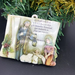 Detailed view of square resin Nativity scene ornament with Holy Family relief pattern
