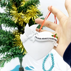 Resin heart Christmas ornament with white dove and In Our Hearts Forever text