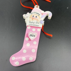 Pink polka dot Christmas stocking resin ornament with baby and polar bear details