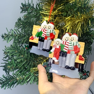 Customized family resin snowman sitting on yellow bench Christmas tree hanging ornaments