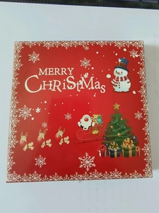 Square red Christmas gift box featuring snowmen and Santa Claus festive illustrations