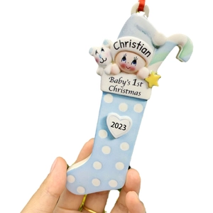Personalized blue resin baby's first Christmas stocking ornament with name and 2023 year