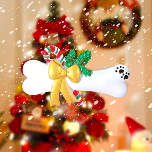 DIY resin Christmas bone ornament with gold bow and paw print for pet tree decor