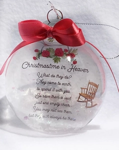 Detail of Christmas memorial ornament featuring red bow and Heaven poem on clear ball