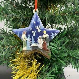 Star-shaped Nativity scene Christmas tree ornament with 5 people and red hanging ribbon