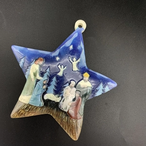 Star-shaped resin Christmas ornament featuring a classic religious Nativity scene on blue