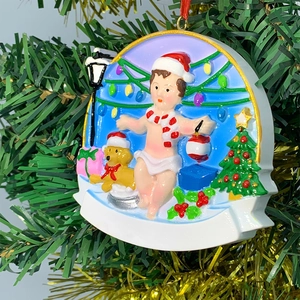Detailed resin Christmas tree ornament with dog and child featuring customizable banner