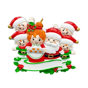 Macro detail of DIY resin Santa family ornament with blank banner for personalized names