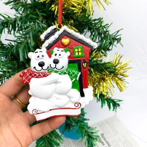 Resin Christmas polar bear house ornament with red hanging ribbon for festive tree decor