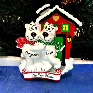 Detailed view of personalized polar bear resin ornament on a festive Christmas tree
