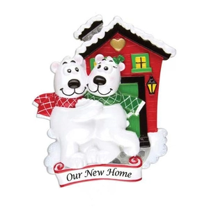 Resin Christmas ornament featuring polar bears and red house with Our New Home text
