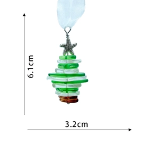 Detail of multi-layer glass sea christmas tree ornament with starfish topper and ribbon