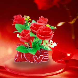 Romantic artificial red roses set in a textured LOVE letter base for home decor