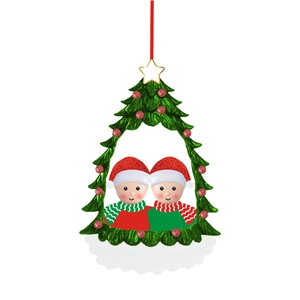 Close-up of personalized resin Christmas tree ornament with cute children figures