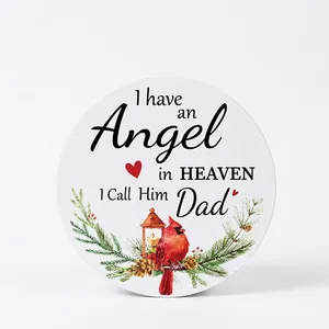 Memorial Christmas ornament with cardinal bird and evergreen branches on white round base