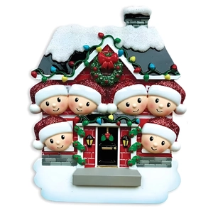 Detail of red resin house ornament with 6 family members and festive snow on roof