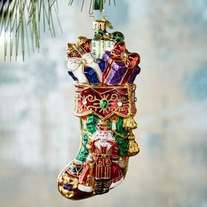 Resin Christmas stocking ornament with nutcracker design and glitter details for tree